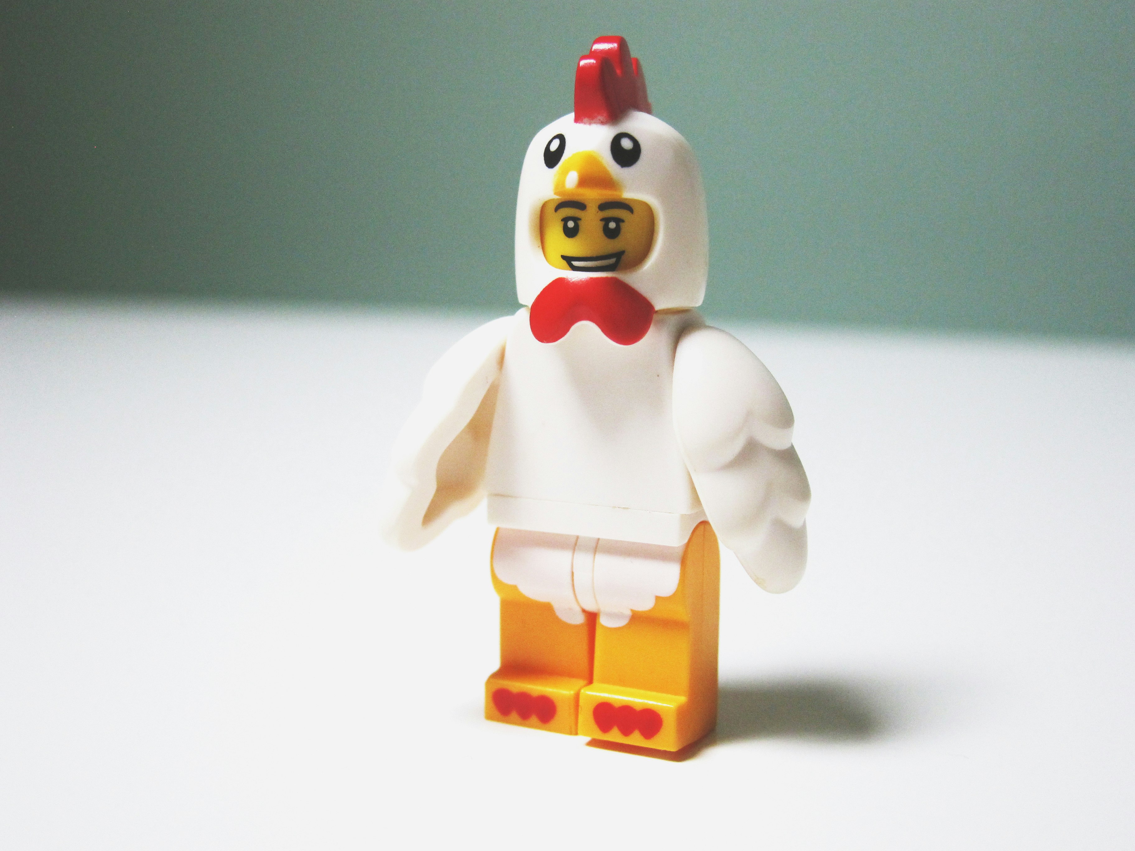 LEGO chicken minifig on table